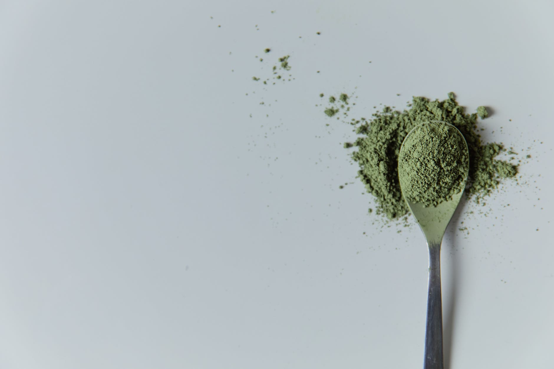 photo of matcha powder on a spoon